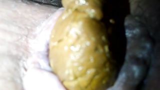 Big yellow turd from her shaved butthole