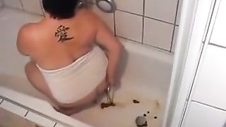 Chubby brunette Spanish babe doing enema