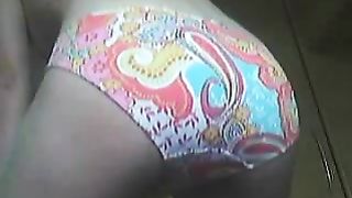 Huge turd in her colorful panties