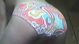Huge turd in her colorful panties