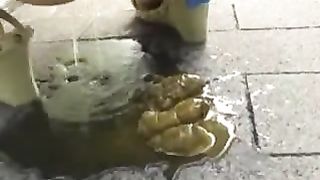 Young Japanese pooping on a bridge in public