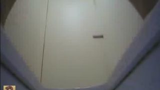 Asian teacher using a public bathroom