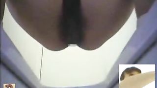 Asian teacher using a public bathroom