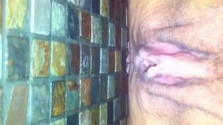 Amateur woman peeing and pooping on bathroom floor