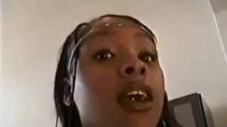 Young black girl shitting on a black homemade toilet