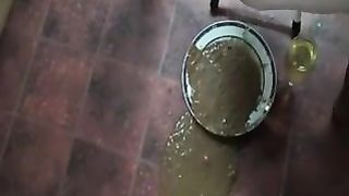 Liquid shit in a metallic plate
