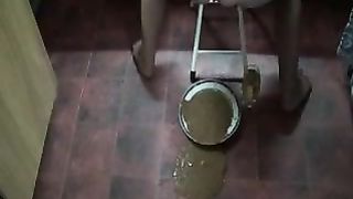 Liquid shit in a metallic plate