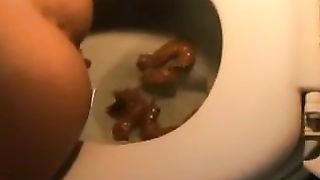 Amateur girl shitting in toilet