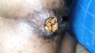 Hairy black girl pooping in doggy style