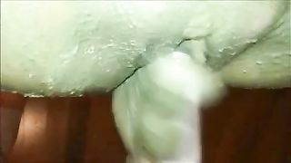 Mature woman smearing shit on shaved pussy