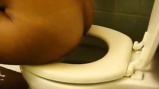 Hot teen shitting over toilet