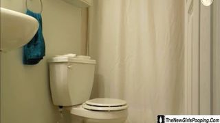 Skinny school girl pooping in toilet