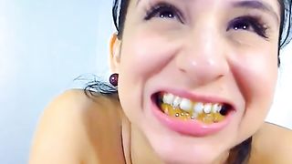 Gipsy girl eating a tiny piece of poop