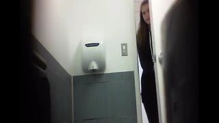Sexy blonde babe shitting in public bathroom floor