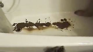 Liquid shit in bathtub