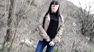 Masked teen eating poop in a forest