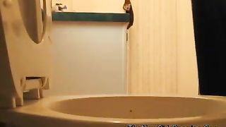 Fat granny pooping over toilet