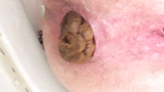 Shaved girl peeing and pooping