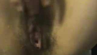 Hairy girl masturbating while peeing
