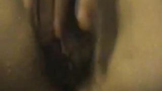 Hairy girl masturbating while peeing