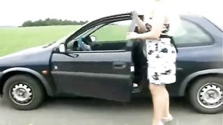 Shitting near her parked black car