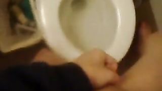 Hot girl peeing over toilet