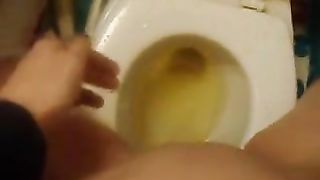Hot girl peeing over toilet