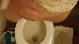 Hairy girl peeing in toilet