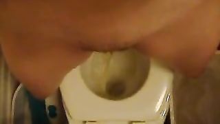 Hairy girl peeing in toilet