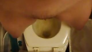 Hairy girl peeing in toilet