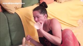 Brunette mature woman shitting on a white plate
