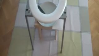Sexy babe shitting on a home made toilet