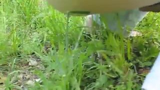 Chubby girl peeing in her back yard