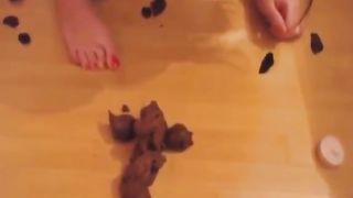 Beautiful brunette eating poop from her dildo