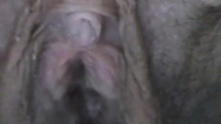 Hairy girl peeing in close up