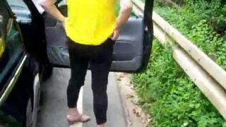 Mature wife peeing on the road
