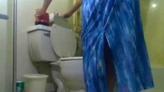 Granny smoking while shitting in toilet