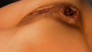 Fingering her pussy while pooping slowly