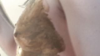 Sexy babe smearing shit on her body