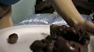 Hairy babe shitting on a white plate