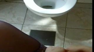 Naughty girl peeing in toilet