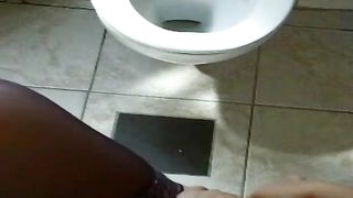 Naughty girl peeing in toilet