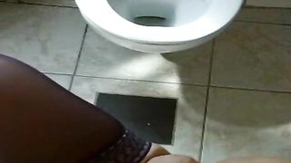 Naughty girl peeing in toilet