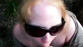 Redhead milf sucking dick outdoor