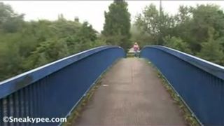 Wearing a pink jacket while peeing outdoor