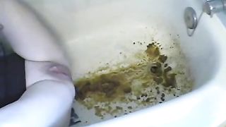 Liquid shit with pressure in bathtub