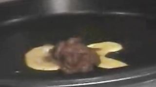 Enema with orange liquid