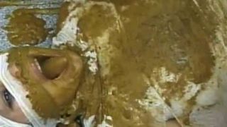 Tattooed girl shitting on her slave