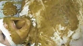 Tattooed girl shitting on her slave