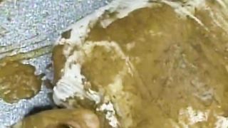 Tattooed girl shitting on her slave